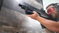 Shooting a gun.